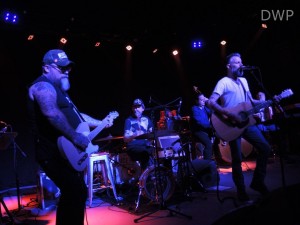 Brian Venable on guitar, Ben Nichols on guitar and vocals, and Roy Berry on drums